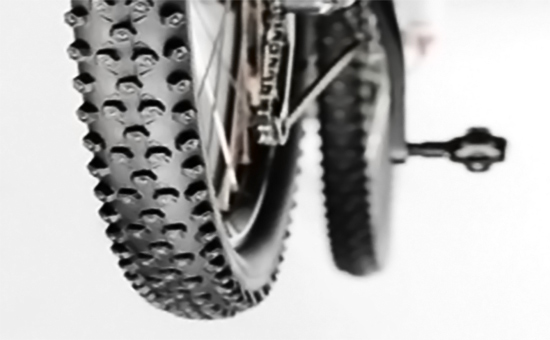 Bicycle tires mixed with isoprene reclaimed rubber to improve performance