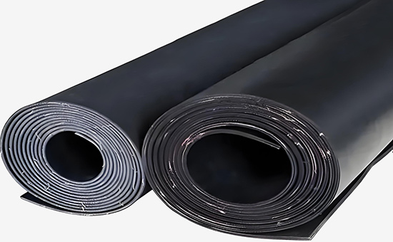 Recycled rubber production of fabric-reinforced rubber sheets
